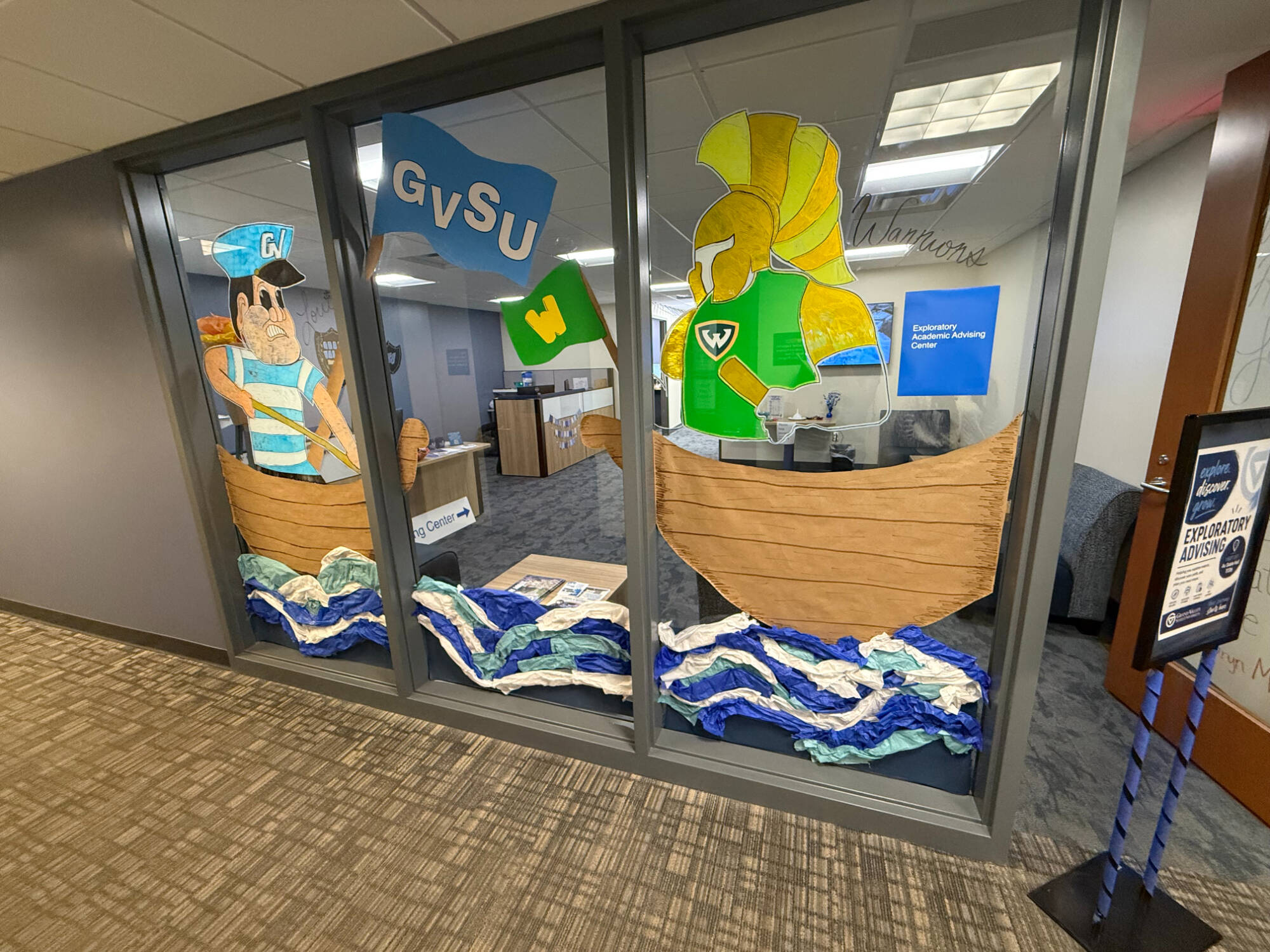 Exploratory Advising Center office decor, drawing of Louie sailing towards opponent